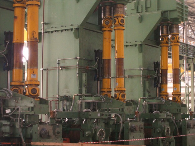 Green industrial plant with yellow transmissions