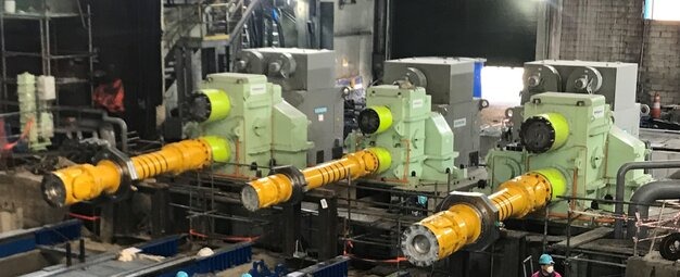 Three yellow EPR transmissions installed on machinery